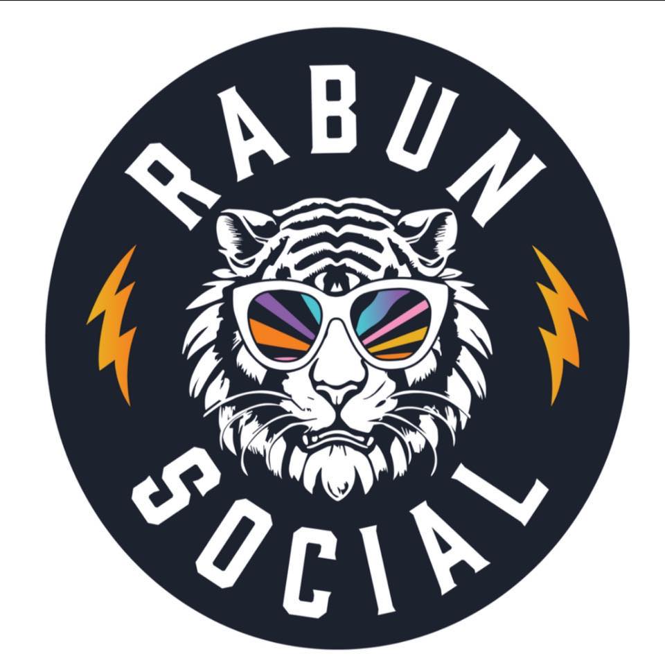 Circular logo: white tiger with colorful sunglasses in a dark circle, orange lightning bolts on sides, 'RABUN SOCIAL' around the edge. - Clayton, GA