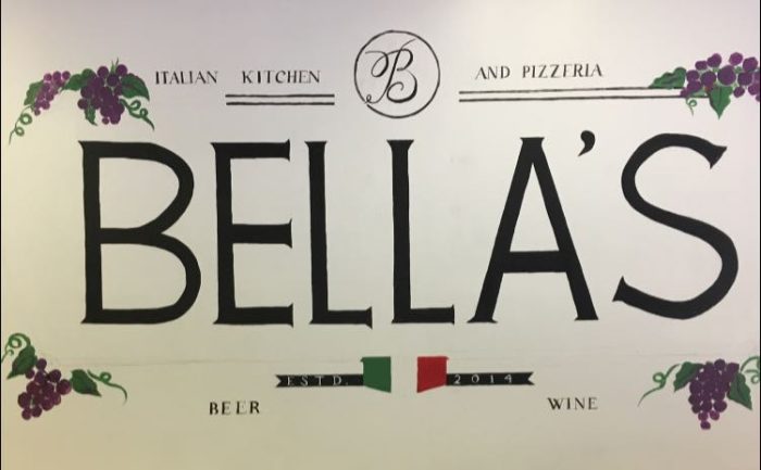 Restaurant sign reading BELLA'S, Italian Kitchen and Pizzeria, with grape garlands, beer and wine, established 2014. - Clayton, GA