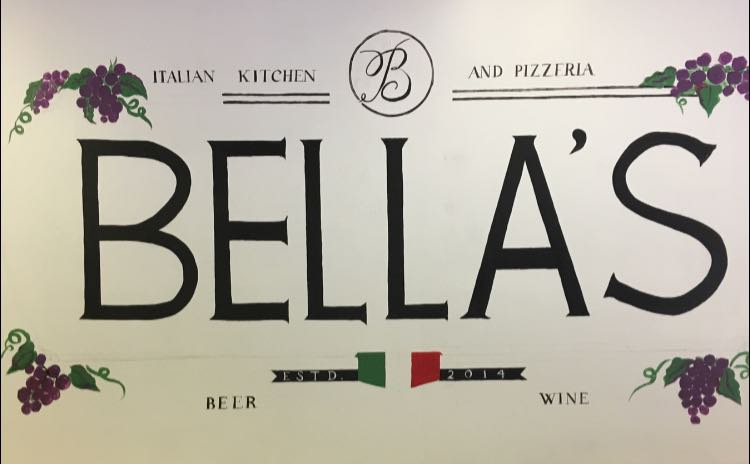 Restaurant sign reading BELLA'S, Italian Kitchen and Pizzeria, with grape garlands, beer and wine, established 2014. - Clayton, GA