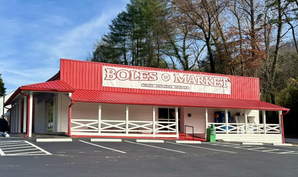 Boles Market - Visit Clayton, GA Front view of Boles Market, a single-story store with a red roof and white exterior, parking lot in foreground. - Clayton, GA